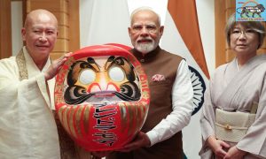 PM Modi receives a Daruma doll from Rev Seishi Hirose, Chief Priest of the Shorinzan Daruma-Ji temple